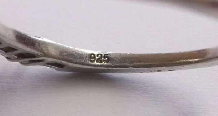 A PRETTY SOLID STERLING SILVER RING WITH FACETED STONES - USE AS A STACKING RING - SWEET !!