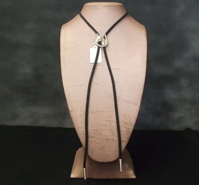 A LUCKY VINTAGE BOLO TIE WITH HORSE AND HORSESHOE MOTIF....COWBOY ACCESSORY !!