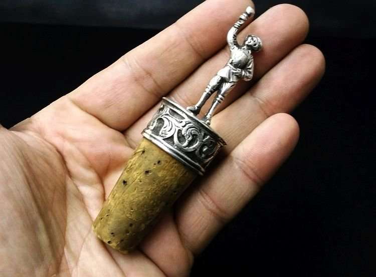 A CHARMING VINTAGE DETAILED CORK HOLDER WITH SILVER CONTENT ...MARKED 90%...LOOKS DUTCH