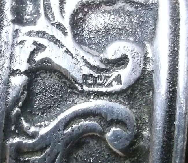 A CHARMING VINTAGE DETAILED CORK HOLDER WITH SILVER CONTENT ...MARKED 90%...LOOKS DUTCH