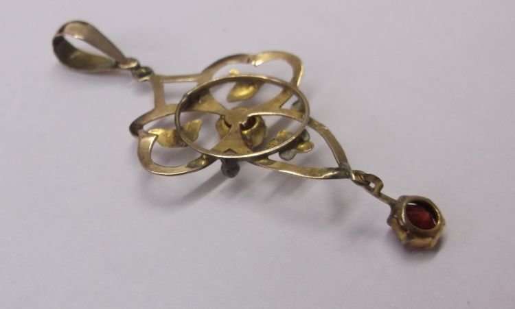 A BEAUTIFUL OLD ART NOUVEAU STYLE 9 CT GOLD PENDANT SET WITH TWO FACETED RED STONES ...WOW !!!
