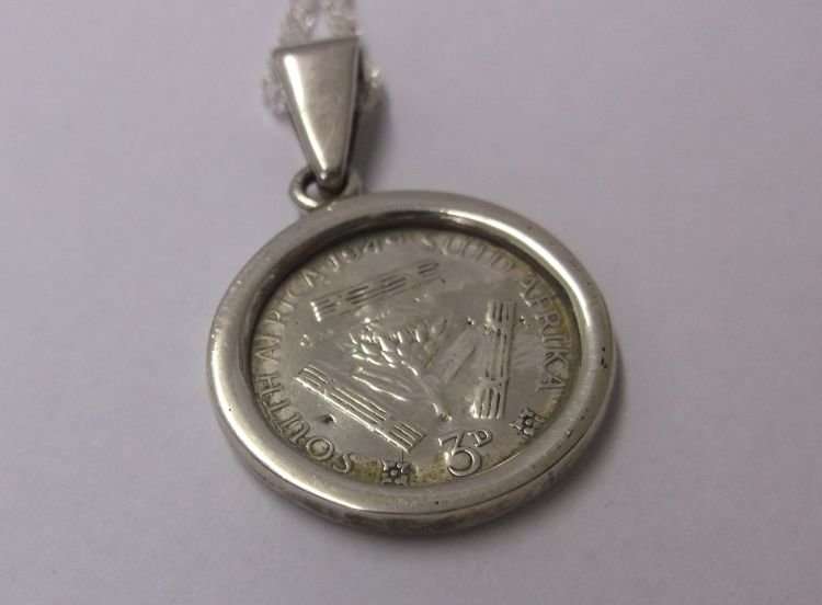 A LOVELY NEW STERLING SILVER NECKLACE WITH AN OLD STERLING SILVER PENDANT SET WITH A SILVER TICKEY !