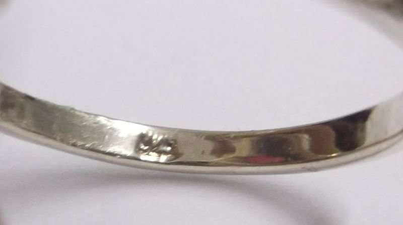 AN OUTSTANDING AND FANCY SOLID STERLING SILVER RING WITH MARCASITE AND A PINK INSET