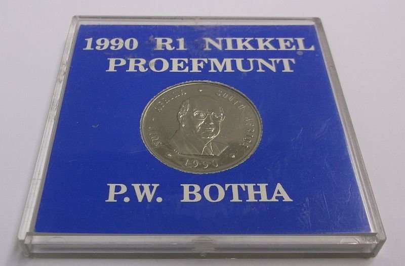 A PROOF 1990 ONE RAND COIN IN ITS PLASTIC HOLDER - P.W BOTHA