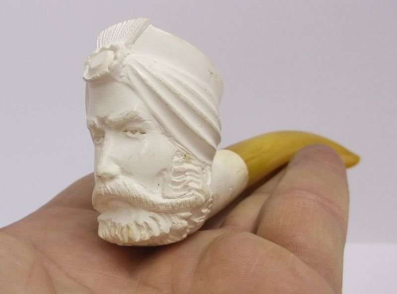 A MARVELOUS VINTAGE MEERSCHAUM PIPE WITH BOWL IN THE SHAPE OF A TURKS HEAD ...AMBER COLOR STEM