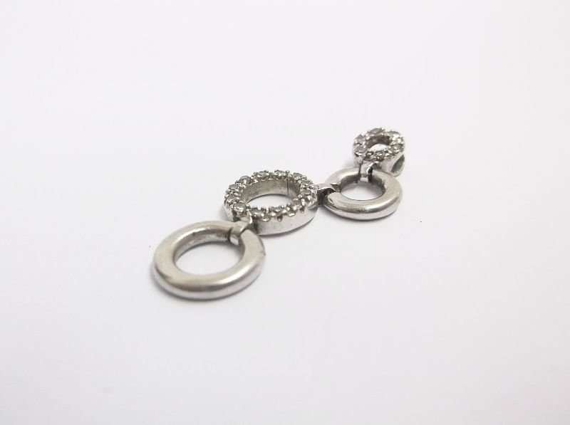 A VERY CLASSY SOLID 10 CT WHITE GOLD PENDANT SET WITH 18 TINY DIAMONDS PLUS STERLING SILVER NECKLACE