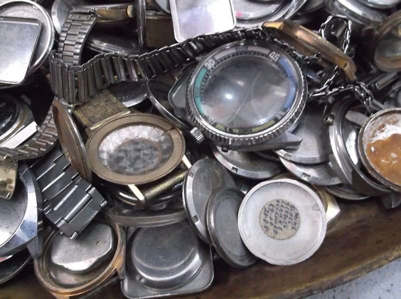 FOR THE WATCH ENTHUSIAST ...LITERALLY 1000`SSS OF WATCH PARTS N STRAPS...YOU ARE BIDDING FOR THE LOT