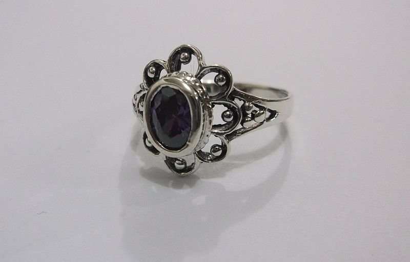 A GORGEOUS SOLID STERLING SILVER RING SET WITH A FACETED PURPLE STONE ...AWESOME !!!