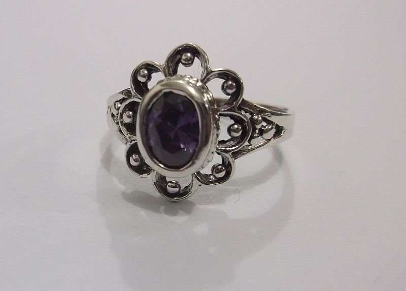A GORGEOUS SOLID STERLING SILVER RING SET WITH A FACETED PURPLE STONE ...AWESOME !!!