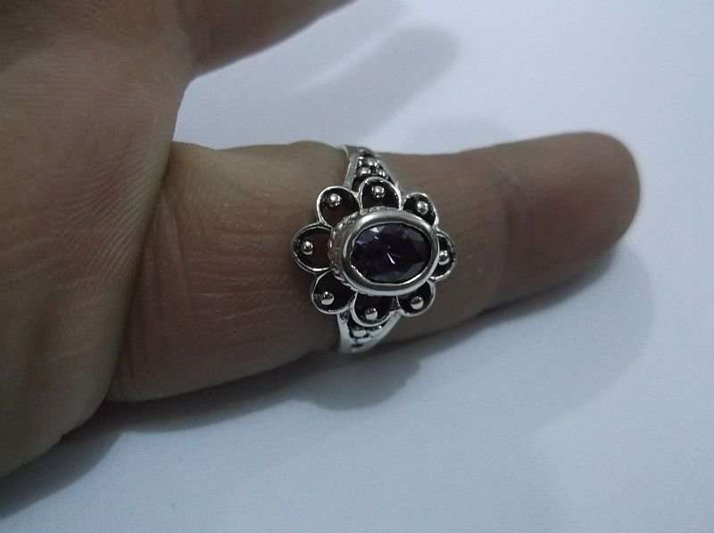 A GORGEOUS SOLID STERLING SILVER RING SET WITH A FACETED PURPLE STONE ...AWESOME !!!