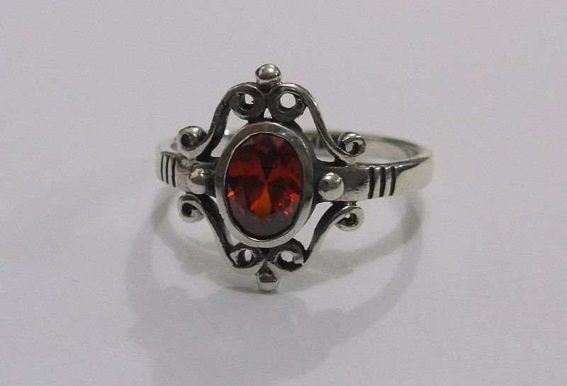 AN AWESOME SOLID STERLING SILVER RING WITH A STRIKING FACETED RED STONE ...MUST HAVE !!!
