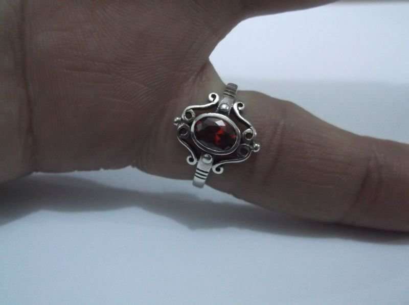 AN AWESOME SOLID STERLING SILVER RING WITH A STRIKING FACETED RED STONE ...MUST HAVE !!!