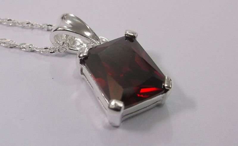 AWESOME STERLING SILVER PENDANT WITH A FIERY RED FACETED STONE PLUS A 45 CM STERLING SILVER NECKLACE