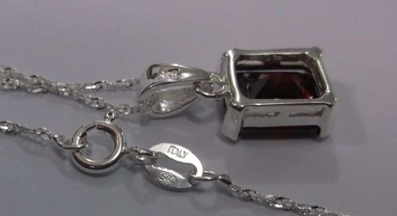 AWESOME STERLING SILVER PENDANT WITH A FIERY RED FACETED STONE PLUS A 45 CM STERLING SILVER NECKLACE
