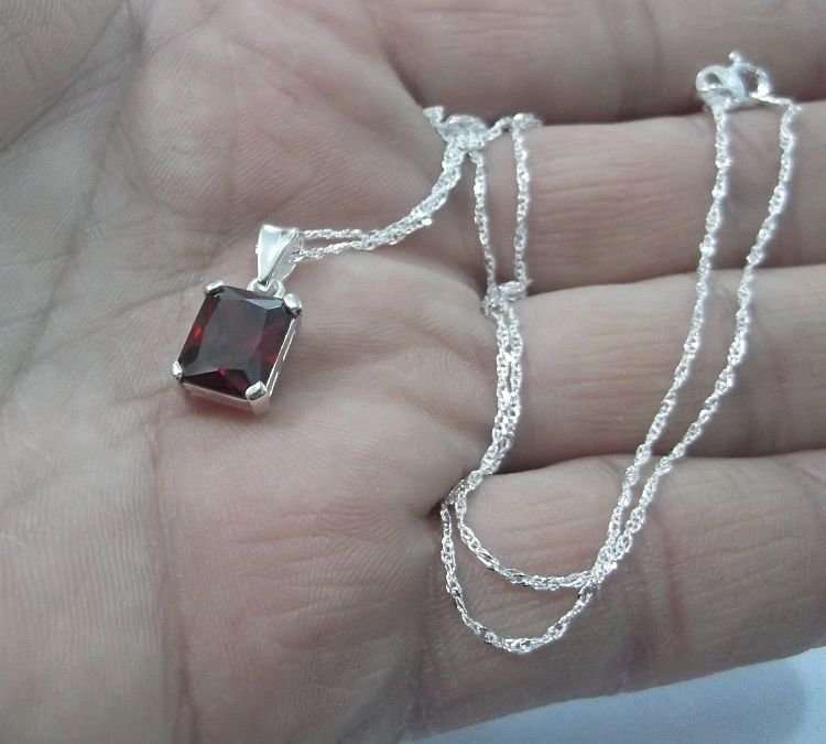AWESOME STERLING SILVER PENDANT WITH A FIERY RED FACETED STONE PLUS A 45 CM STERLING SILVER NECKLACE