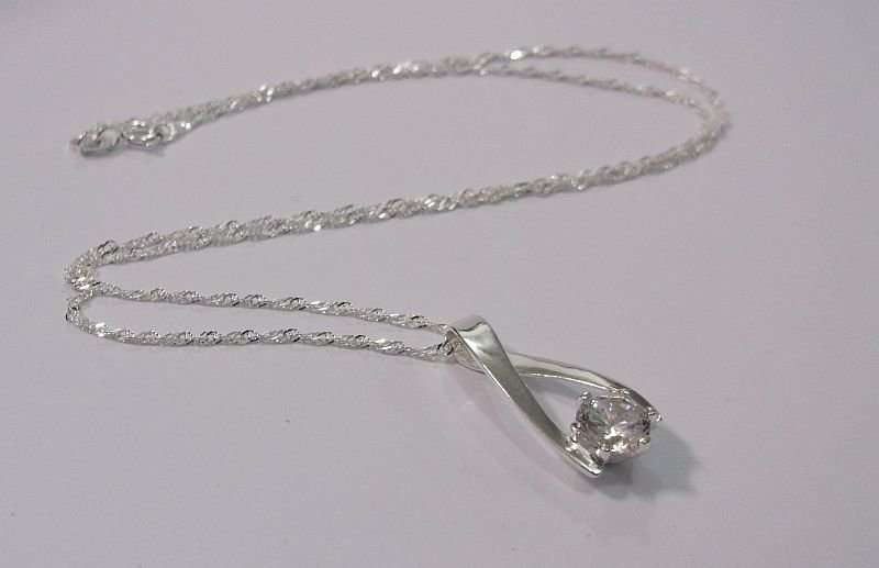 CLASSY STERLING SILVER PENDANT WITH FACETED CLEAR STONE PLUS A 45 CM STERLING SILVER NECKLACE...WOW