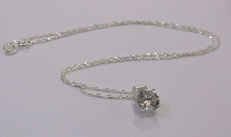 CLASSY STERLING SILVER PENDANT SET WITH A FACETED CLEAR STONE PLUS A 45 CM STERLING SILVER NECKLACE