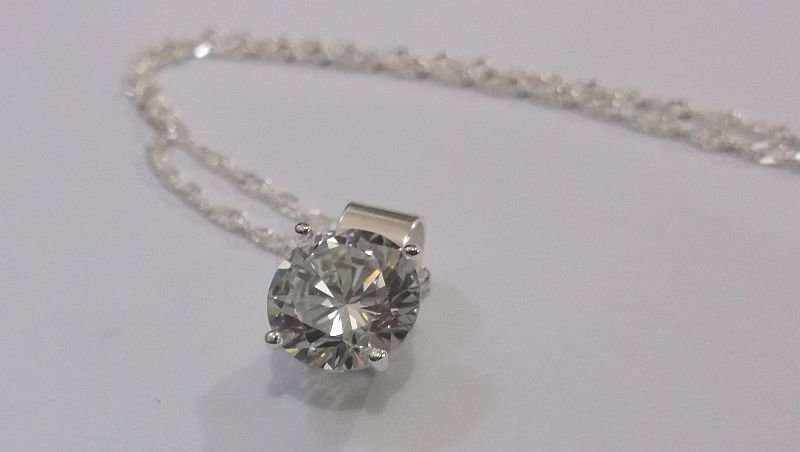 CLASSY STERLING SILVER PENDANT SET WITH A FACETED CLEAR STONE PLUS A 45 CM STERLING SILVER NECKLACE