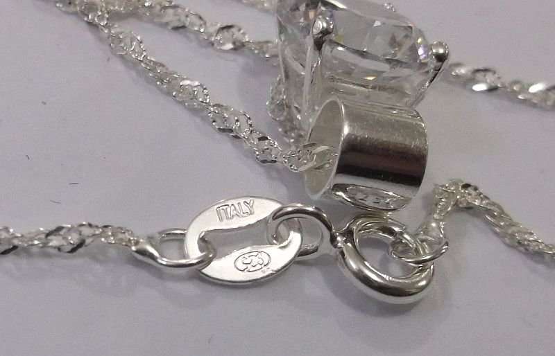 CLASSY STERLING SILVER PENDANT SET WITH A FACETED CLEAR STONE PLUS A 45 CM STERLING SILVER NECKLACE