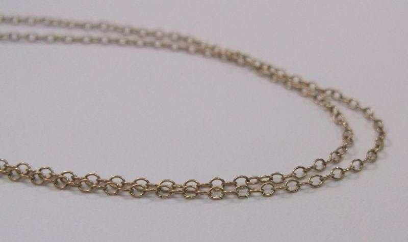 A STUNNING ANTIQUE 9 CARAT GOLD NECKLACE WITH TEAR SHAPED PENDANT AND FACETED RAINBOW LOOK STONE