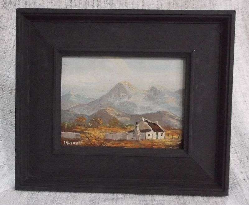 A LOVELY ORIGINAL OIL ON BOARD BY JUNE TUCKETT DEPICTING A HOMESTEAD SURROUNDED BY A MOUNTAIN RANGE