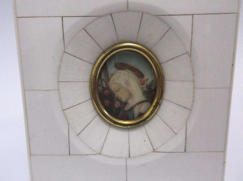 AN EXQUISITE OLD HAND PAINTED PICTURE OF A MAIDEN IN A PRE BAN IVORY OR BONE FRAME