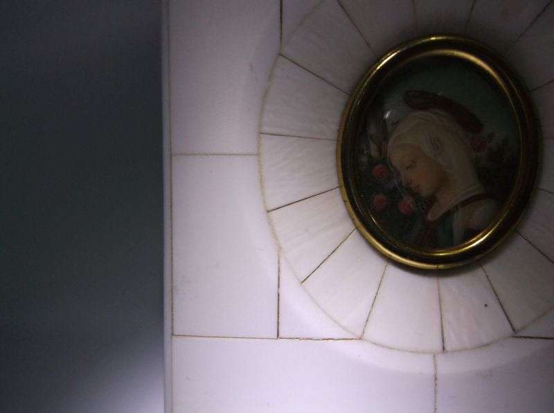 AN EXQUISITE OLD HAND PAINTED PICTURE OF A MAIDEN IN A PRE BAN IVORY OR BONE FRAME