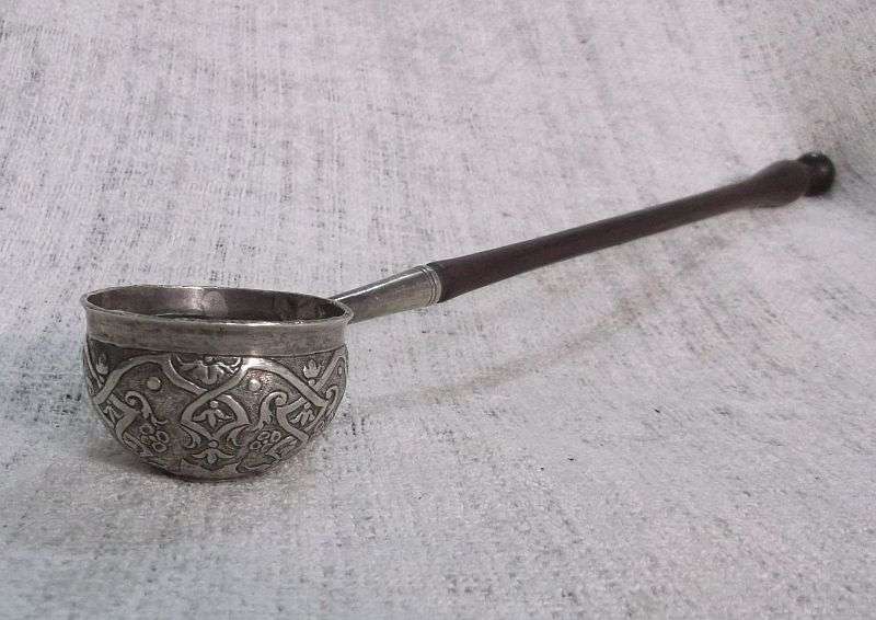 AN INTRIGUING NORWEGIAN SILVER BOWL LADLE SET WITH A 308 YEAR OLD COIN REIGN OF KING FREDERICK IV