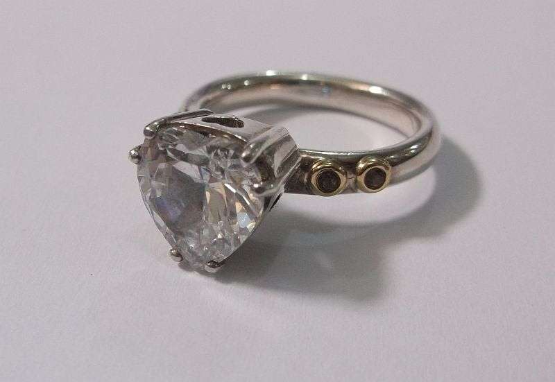 A BREATH TAKING STERLING SILVER RING BY PANDORA SET WITH A FACETED HEART SHAPED STONE ....WOW....!!!