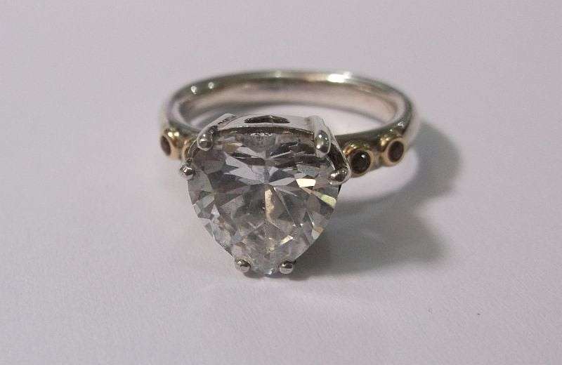 A BREATH TAKING STERLING SILVER RING BY PANDORA SET WITH A FACETED HEART SHAPED STONE ....WOW....!!!