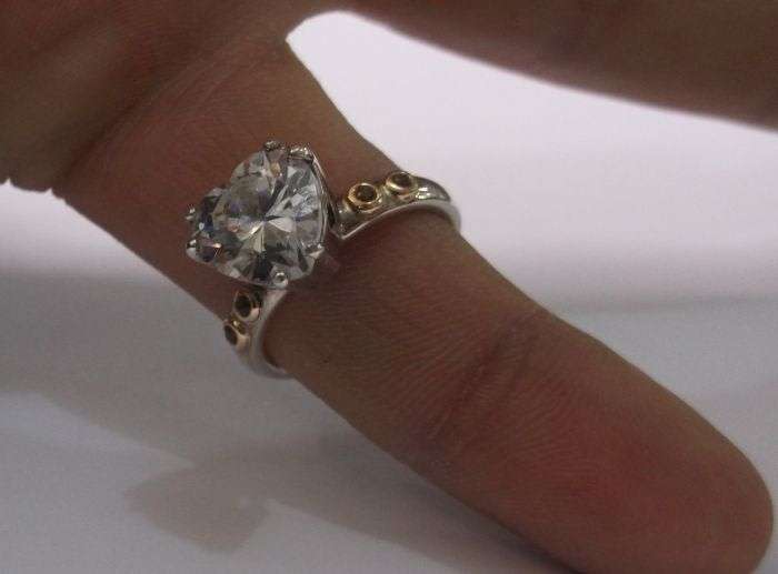 A BREATH TAKING STERLING SILVER RING BY PANDORA SET WITH A FACETED HEART SHAPED STONE ....WOW....!!!