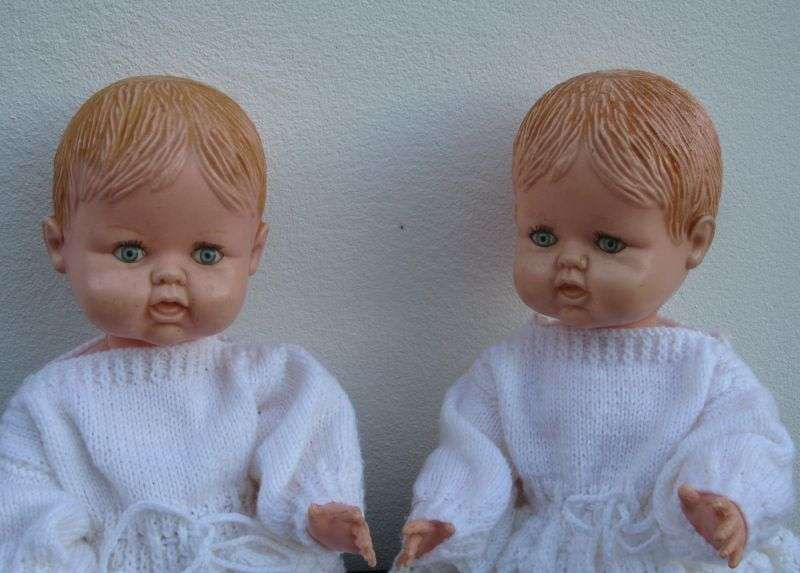 TOO CUTE !! A PAIR OF VINTAGE HARD PLASTIC BABY DOLLS WITH HAND MADE CLOTHING ...BID FOR BOTH ...WOW