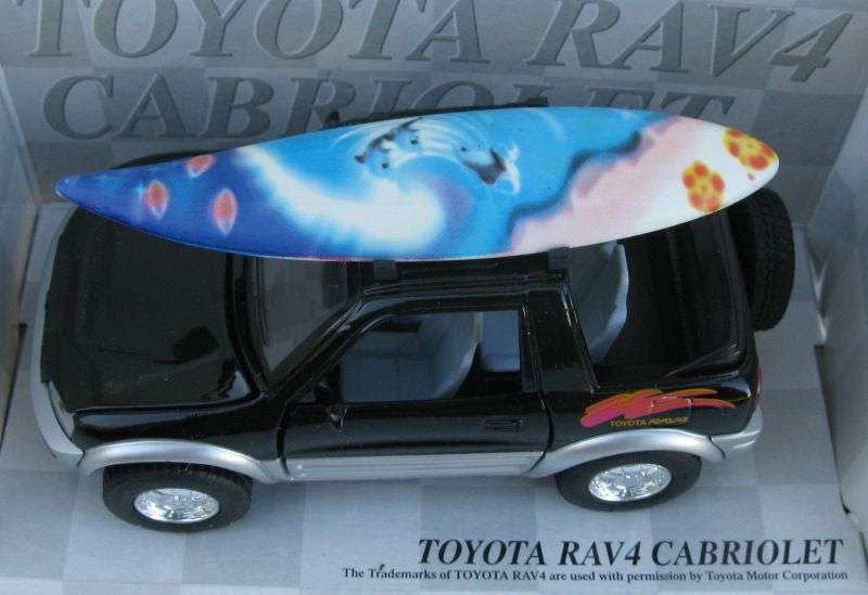 SWEET DUDE !! A 1:32 SCALE DIE CAST METAL MODEL OF THE TOYOTA RAV4 CABRIOLET WITH SURFBOARD ...NICE