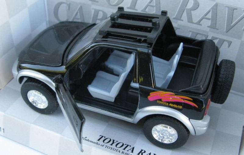 SWEET DUDE !! A 1:32 SCALE DIE CAST METAL MODEL OF THE TOYOTA RAV4 CABRIOLET WITH SURFBOARD ...NICE