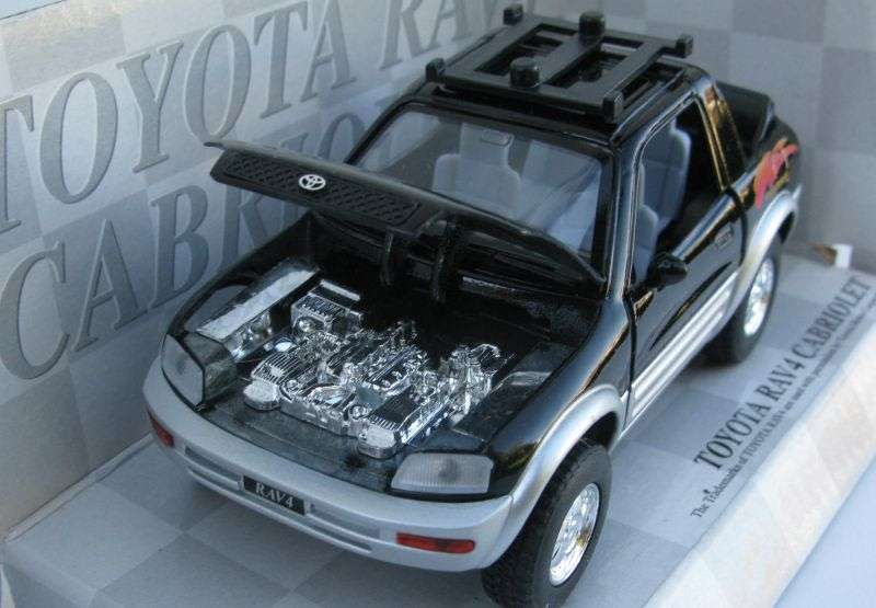 SWEET DUDE !! A 1:32 SCALE DIE CAST METAL MODEL OF THE TOYOTA RAV4 CABRIOLET WITH SURFBOARD ...NICE