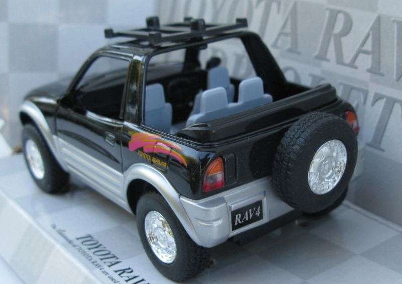 SWEET DUDE !! A 1:32 SCALE DIE CAST METAL MODEL OF THE TOYOTA RAV4 CABRIOLET WITH SURFBOARD ...NICE