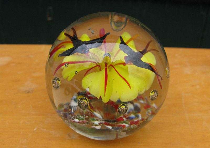 LOVELY !! A RARE VINTAGE SOLID GLASS PAPERWEIGHT WITH YELLOW FLOWER AND BLACK BIRD DETAIL...WOW !!!
