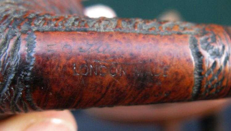 THREE VINTAGE SMOKING PIPES PLUS RACK
