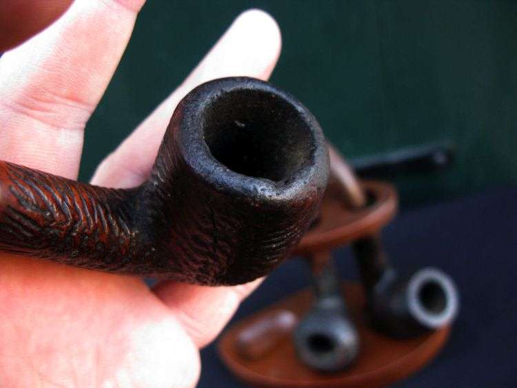 THREE VINTAGE SMOKING PIPES PLUS RACK