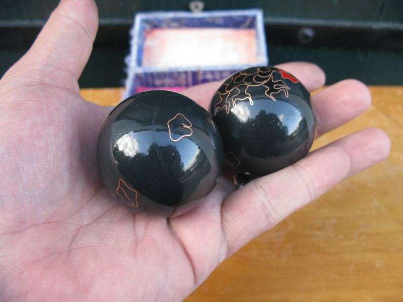 A GREAT LOOKING PAIR OF VINTAGE CHINESE "STRESS BALLS" IN A WELL WORN BOX ...DRAGON & ROOSTER THEME