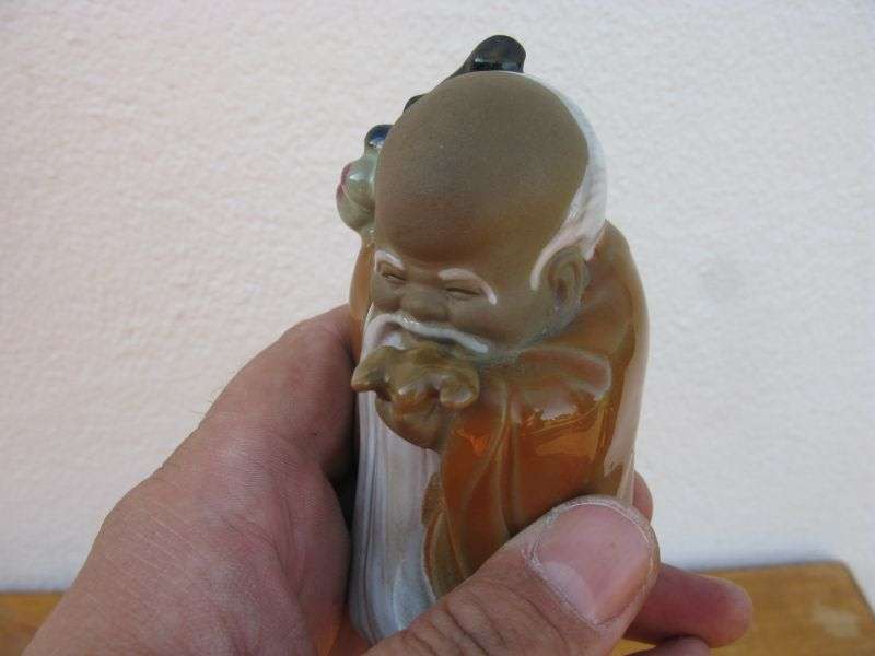 A LOVELY VINTAGE NUMBERED CHINESE CLAY IMMORTAL FIGURE WITH WOODEN STAND ...TOO CUTE !!