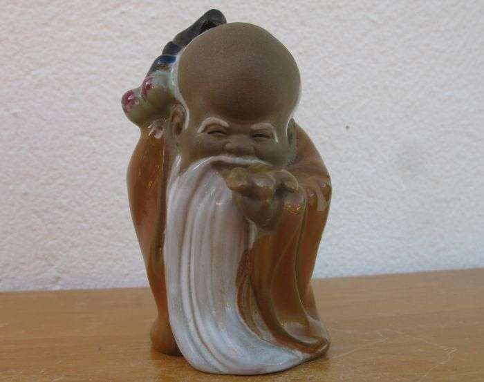 A LOVELY VINTAGE NUMBERED CHINESE CLAY IMMORTAL FIGURE WITH WOODEN STAND ...TOO CUTE !!
