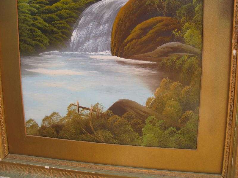 AN ANTIQUE ORIGINAL OIL ON BOARD OF A TRANQUIL WATERFALL AND FLOWING MOUNTAIN BACKGROUND