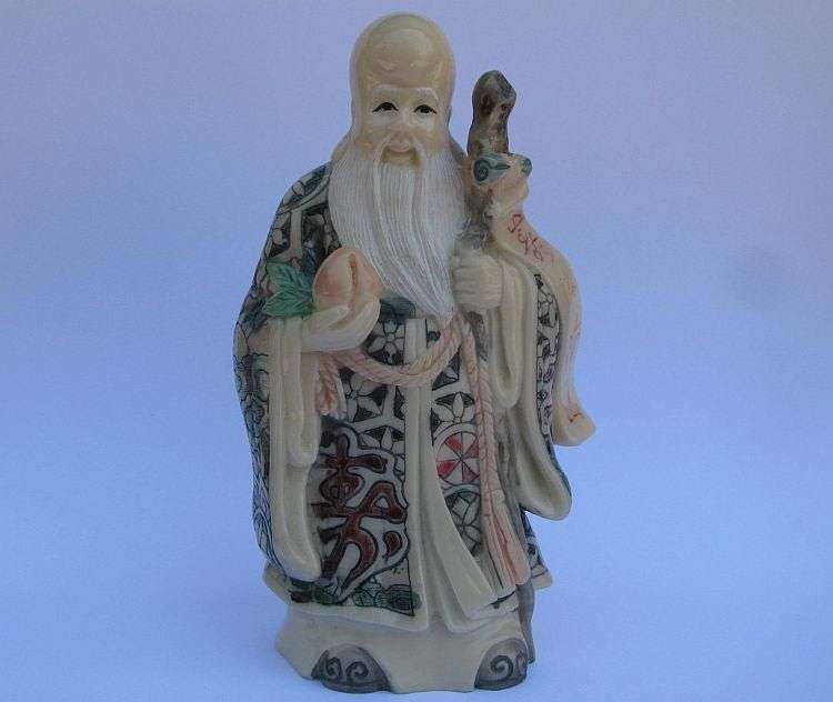 A SUPERB SIGNED VINTAGE ORIENTAL FIGURE OF AN IMMORTAL ...NOT SURE OF COMPOSITION ...VERY COOL !!