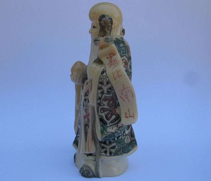 A SUPERB SIGNED VINTAGE ORIENTAL FIGURE OF AN IMMORTAL ...NOT SURE OF COMPOSITION ...VERY COOL !!