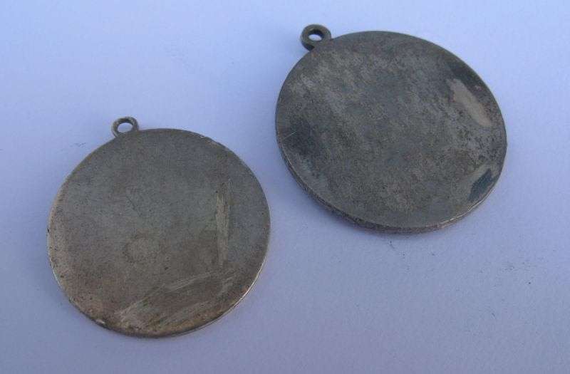 A STUNNING COLLECTION OF 8 RELIGIOUS MEDALLIONS INCLUDING A FRENCH STERLING SILVER ENAMELED MADONNA