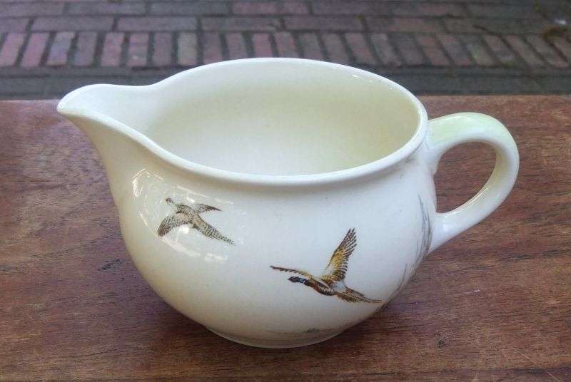 A LOVELY ART DECO PERIOD GRAVY BOAT BY ROYAL DOULTON IN ""THE COPPICE "" PATTERN