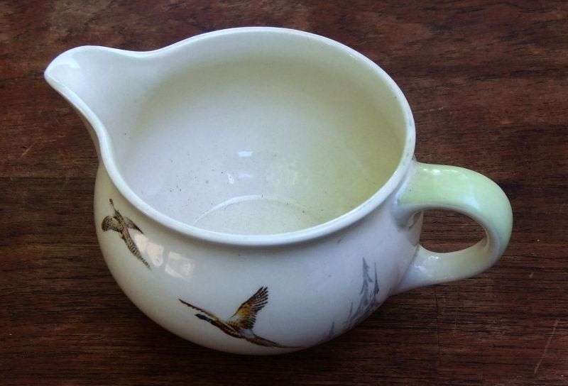 A LOVELY ART DECO PERIOD GRAVY BOAT BY ROYAL DOULTON IN ""THE COPPICE "" PATTERN