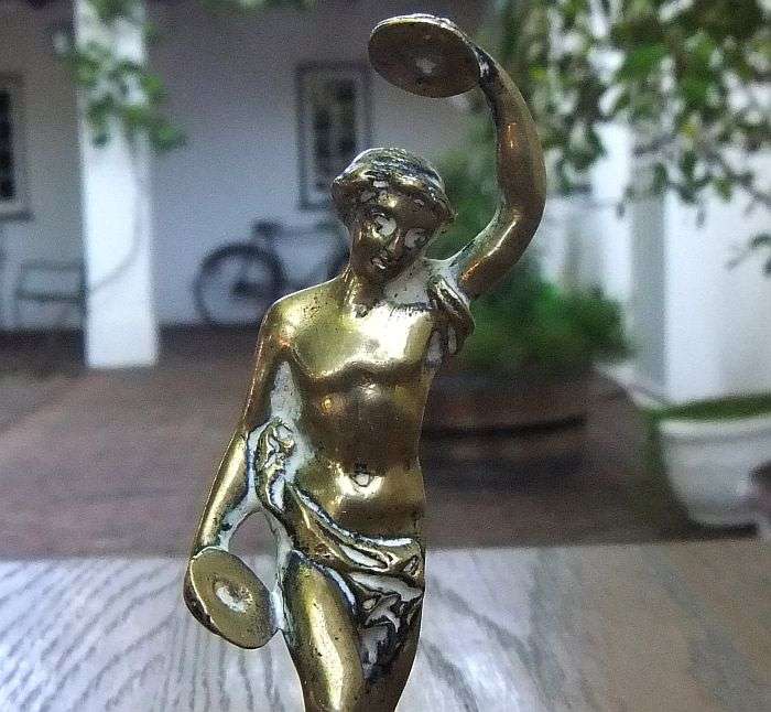 AN AWESOME OLD SOLID BRASS STATUE OF A ROMANESQUE FIGURE ...PERHAPS DANCING ...DETAILED PIECE !!