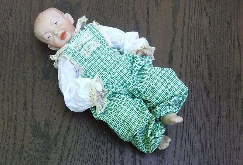 AN OLD PORCELAIN DOLL WITH INTERESTING MAKERS MARKS...HEXAGRAM AND NUMBERS ...EXCELLENT QUALITY